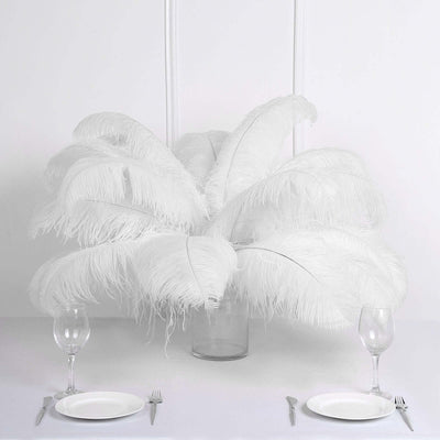White feather centerpiece in a glass vase for elegant dining decor