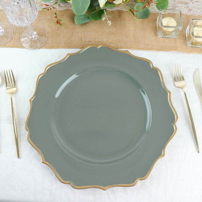 Elegant gray dinner plate with gold scalloped edge on a table setting.