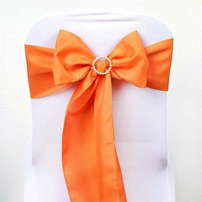 Orange chair sash bow with pearl embellishment