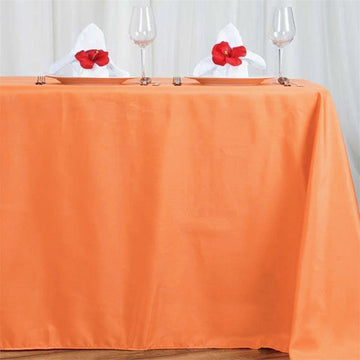 Elevate Your Event Decor with the Orange Seamless Polyester Rectangle Tablecloth