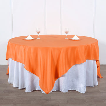 Add Elegance to Your Event with the Orange Seamless Square Polyester Table Overlay 90"x90"