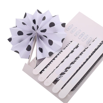 Create a Striking Black and White Theme with These Hanging Paper Fan Decorations