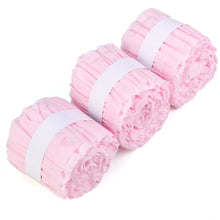 Three rolls of blush ruffled tissue paper with white ribbons, balloon & décor garlands