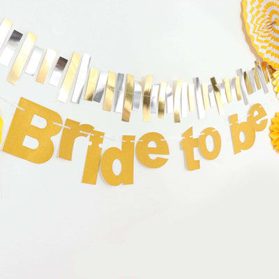 Gold "Bride to Be" banner with decorative accents