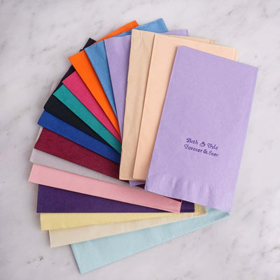 Colorful assortment of paper napkins in various shades for events and gatherings.