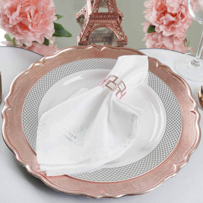Elegant table setting with a personalized napkin on a decorative plate.