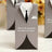 Groom and bride wedding favor box design with tuxedo theme.