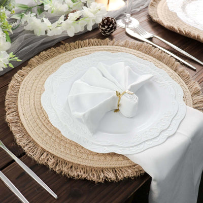 Elegant white plate with decorative napkin on a rustic table setting.