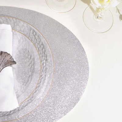 Silver glitter placemat set with elegant dining accessories.