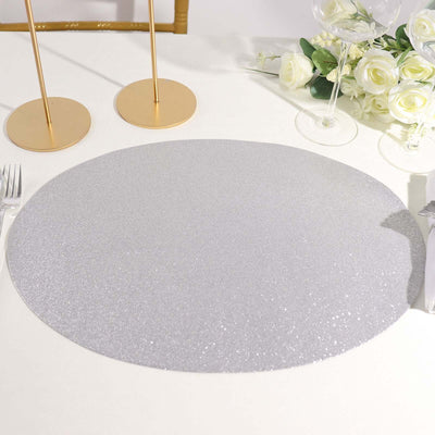 Silver glitter placemat on a table setting with elegant decor.