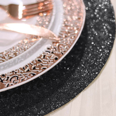 Elegant black glitter placemat with intricate rose gold detailing and tableware.