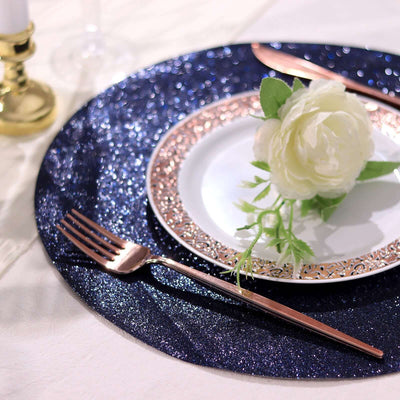 Elegant table setting with rose gold utensils and floral decoration.