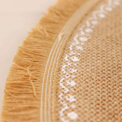 Close-up of a textured round woven mat with fringe detail.