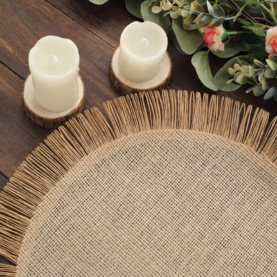 Natural woven placemat with fringed edges, styled with candles and greenery.