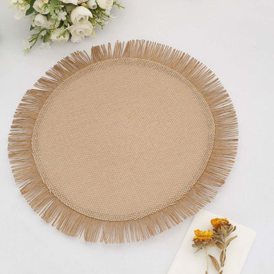 Round woven placemat with fringe detail on a white background