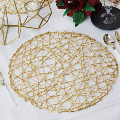 Gold decorative placemat with intricate design on a dining table.