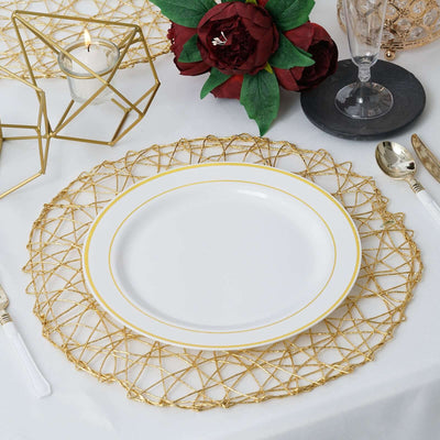 Elegant white plate on a gold wire placemat, surrounded by floral decor and glassware.