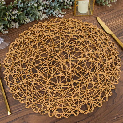 Round woven placemat in natural tones on a wooden table.