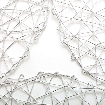 Silver decorative wire mesh art pieces on a plain white background
