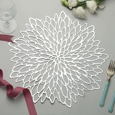 Elegant silver flower-shaped placemat with detailed cutout design.