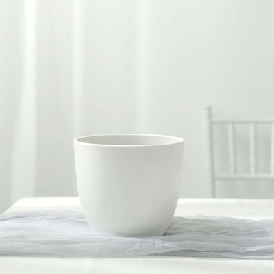 White ceramic pot on a plain table setting