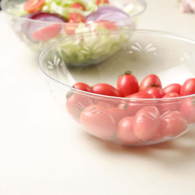 Fresh cherry tomatoes in a clear bowl on a kitchen countertop.