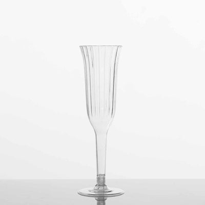 Clear ribbed champagne flute with a tall, elegant shape.