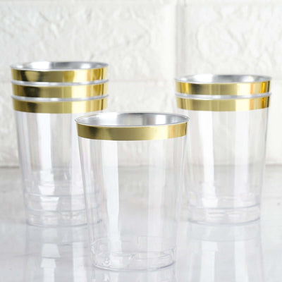 Clear plastic cups with gold rims, perfect for parties and events.