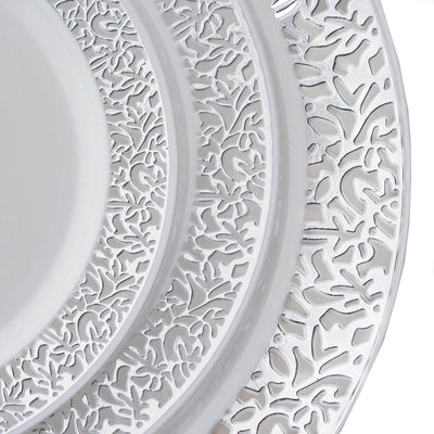 Decorative white plates with intricate lace-like patterns.