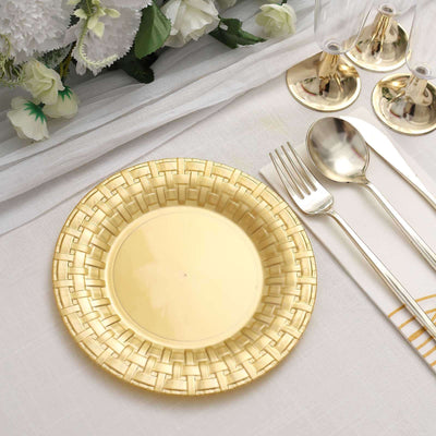 Gold woven design plate on a table setting with utensils and decor.