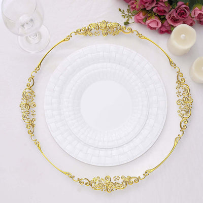 Elegant white plates with gold ornate trim on a white background.