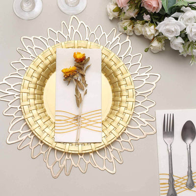 Elegant gold plate setting with floral accent and decorative napkin.
