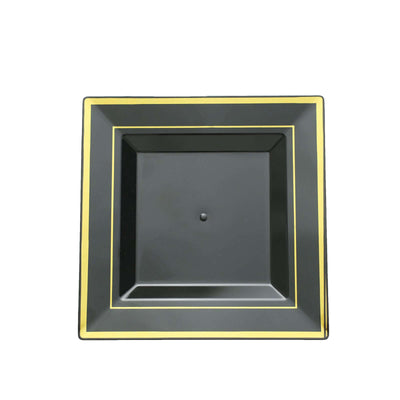 Black square plate with gold trim, studio shot.