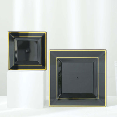 Elegant black square plates with gold trim on a white pedestal.