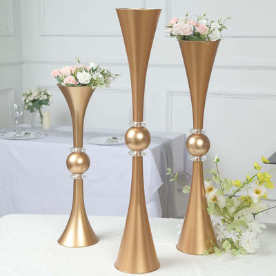 Elegant gold vases with floral arrangements for home decor