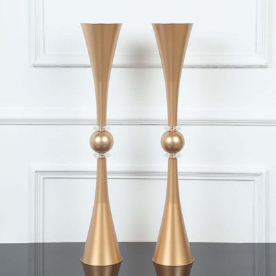 Elegant gold decorative vases with clear accents, perfect for home decor.