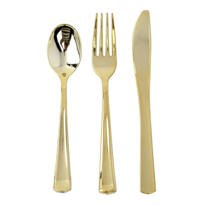 Gold stainless steel cutlery set: spoon, fork, and knife on white background