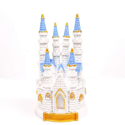 White castle figurine with blue and gold accents on a plain background.