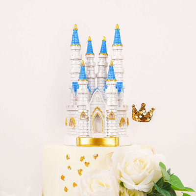 Cinderella castle cake topper with blue towers and gold accents