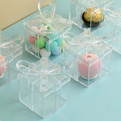 Clear gift boxes with colorful contents on a blue background.