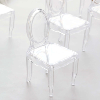 Clear acrylic mini chair on a plain background