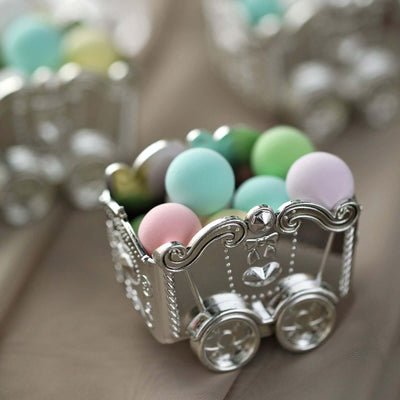 Silver decorative cart filled with pastel-colored beads.