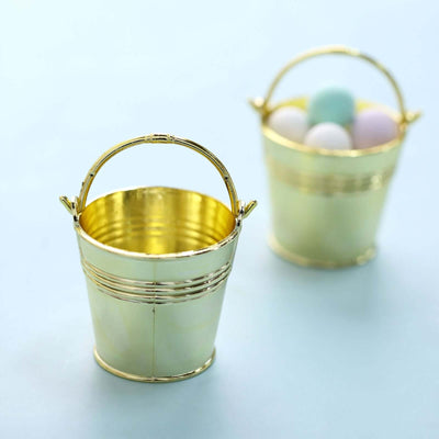 Gold mini buckets filled with pastel eggs