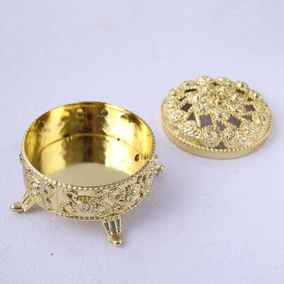 Gold decorative box with intricate design and removable lid.