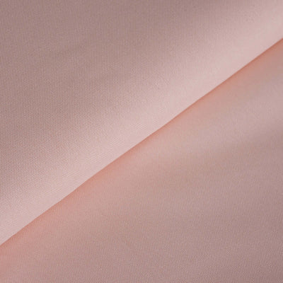 Light pink fabric texture with a smooth, soft finish.