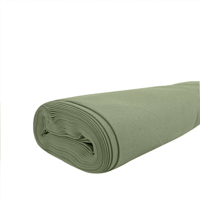 Green fabric roll on a white background for sewing and crafting projects.
