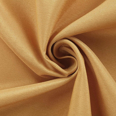 Golden fabric swirl showcasing soft texture and rich color.