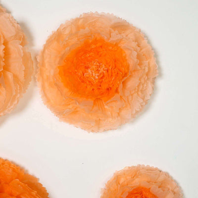 Peach paper flower decorations on a white background