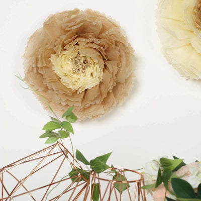 Cream and beige decorative paper flower on a plain background.