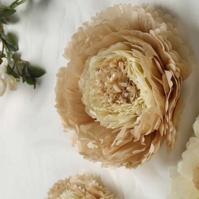 Beige paper flower decoration on a plain background.